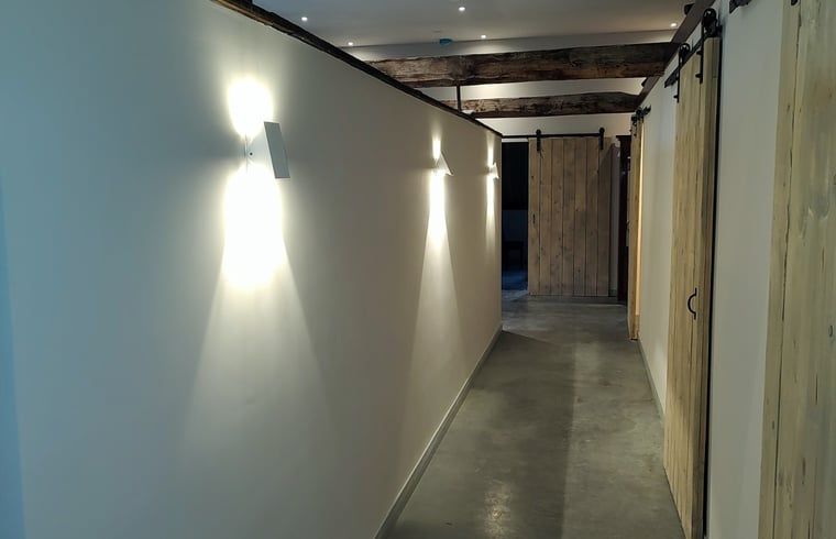 Illuminated hallway in Holiday home in Nieuwleusen, Salland, with wooden doors in Overijssel.