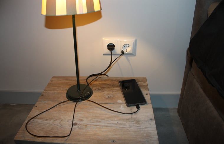 Bedside table with lamp in Holiday home in Nieuwleusen, Salland, Overijssel.