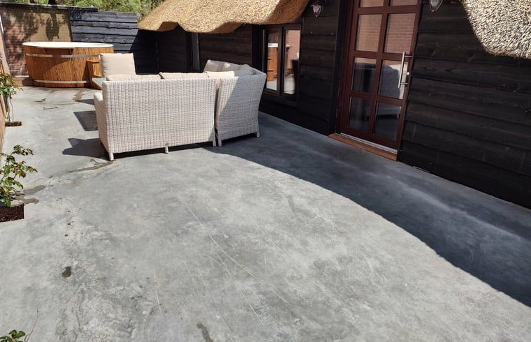 Cozy terrace with seating in Holiday home in Nieuwleusen, Salland, Overijssel.