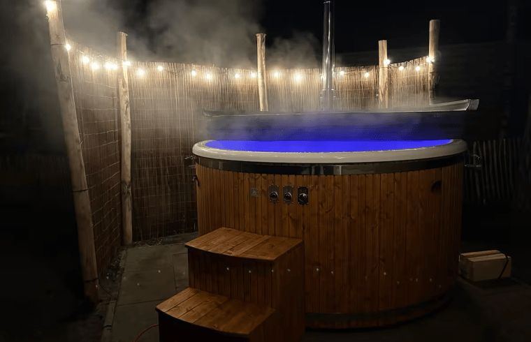 Enjoy a romantic evening in the illuminated hot tub at Holiday Home in Haarle, Overijssel.