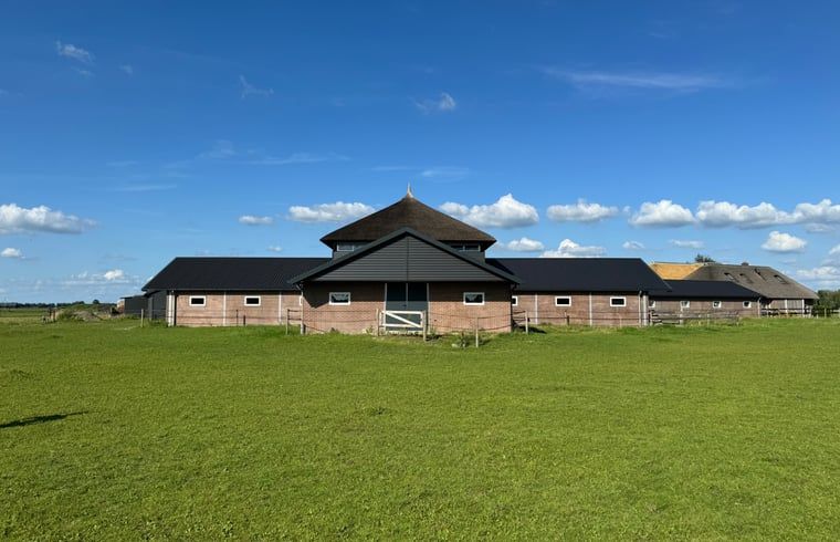 Vakantiehuisje in Boskamp, Salland, met prachtig uitzicht op groene velden in Overijssel.