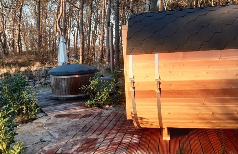 Sauna and hot tub at Holiday home in Ommen, Vecht region, Overijssel, in the evening sun.