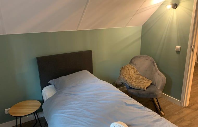 Bedroom with single bed in Holiday cottage in Marienberg, Vechtstreek, Overijssel.