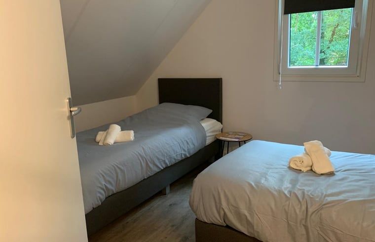 Bedroom with two beds in Holiday cottage in Marienberg, Vechtstreek, Overijssel.