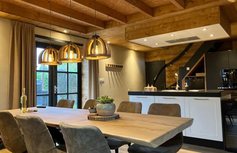 Cozy indoor cottage in Giethmen, Overijssel with wooden interior and modern kitchen in the Vecht region.