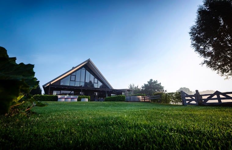 View of Holiday home in Hoonhorst at sunset, located in the Vecht region, Overijssel.