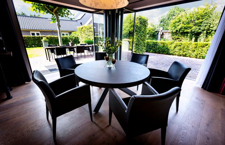 Round dining table at Holiday home in Hoonhorst, cozy gathering in the Vecht region, Overijssel.