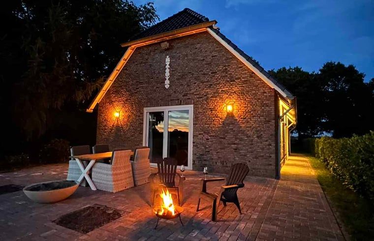 Atmospheric terrace at cottage in Kloosterhaar, Vechtstreek, Overijssel with evening lighting.