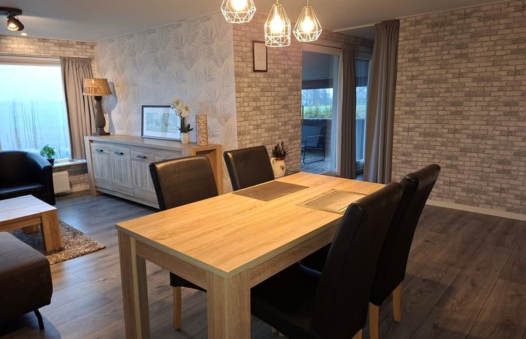 Cozy interior of Holiday home in Zwartsluis, Overijssel, with modern kitchen and dining area for a relaxing stay.