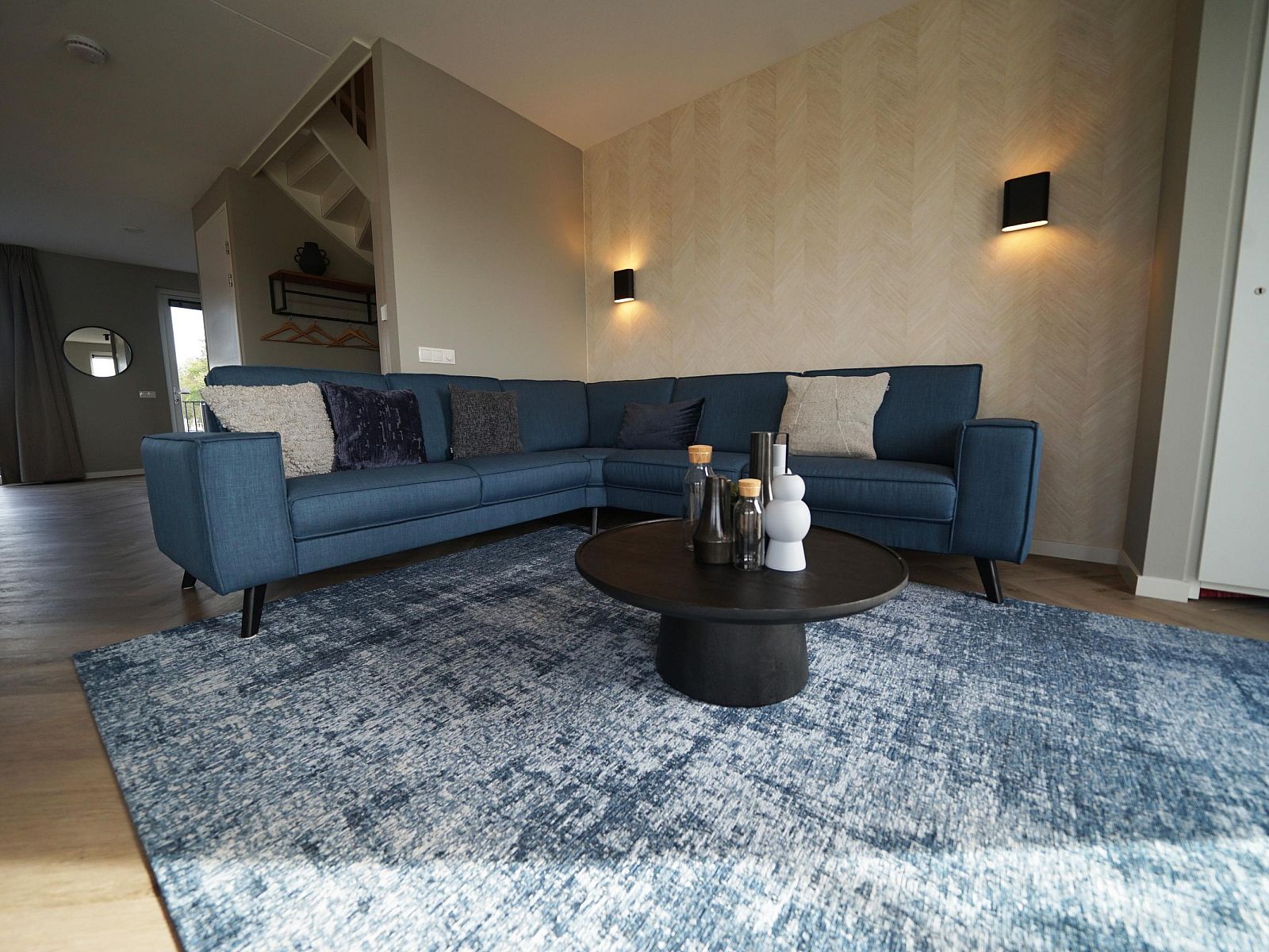 Stylish living room of Apartment in Kampen in Northwest Overijssel, with modern furnishings and comfortable corner sofa.