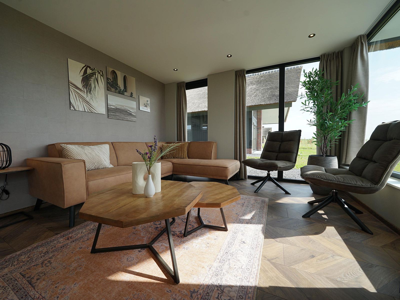 Stylish living room in a detached house in Kampen, Northwest Overijssel, with modern furnishings and views of the natural surroundings.