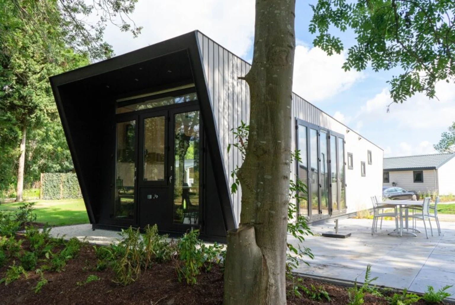 Detached house in IJhorst, a modern vacation home surrounded by nature in Northwest Overijssel, with a spacious veranda and green views.