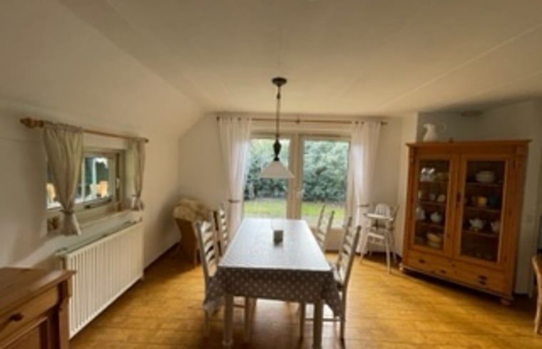 Spacious dining room in Holiday Home in IJhorst, with lots of natural light and views of the garden.