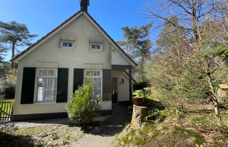 Front view of Holiday home in IJhorst, surrounded by wooded area in Northwest Overijssel.
