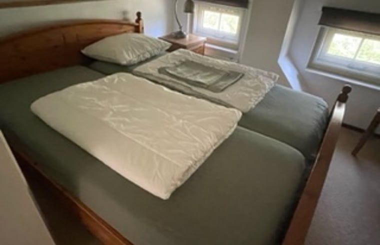 Comfortable bedroom in Holiday Home in IJhorst, with double bed and restful atmosphere.