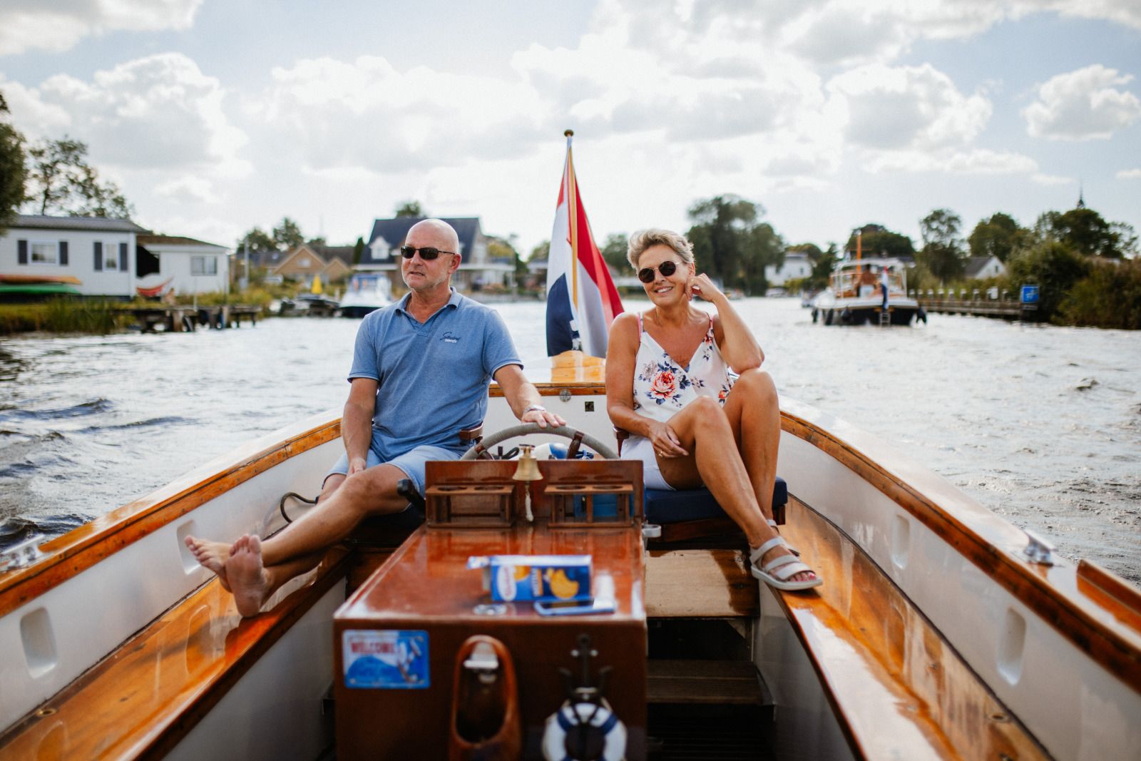 Stylish interior of OV684 vacation home in Blokzijl, with sofa and flowers, Northwest Overijssel.
