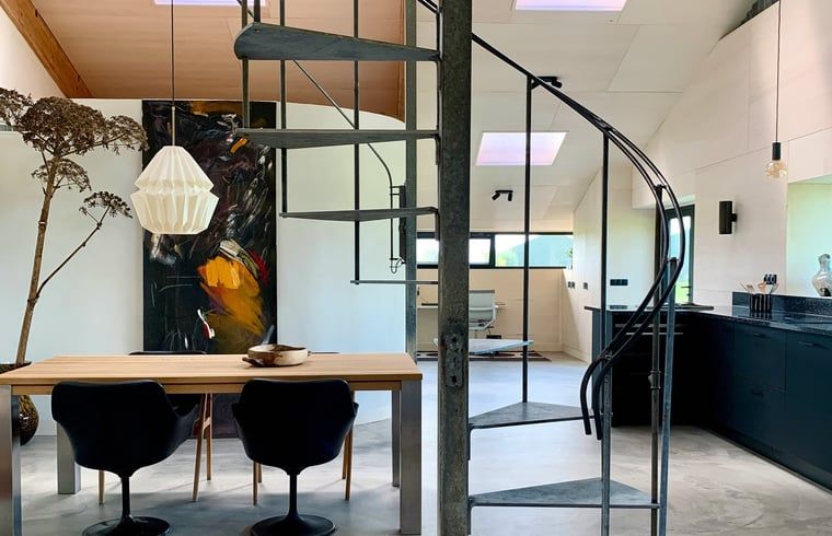 Modern interior space with spiral staircase in Holiday home in Zalk, perfect for a relaxing stay in Overijssel.