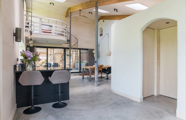Open kitchen and dining area in Holiday Home in Zalk, Northwest Overijssel, ideal for socializing.