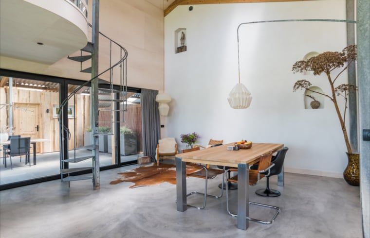 Stylish dining room in Holiday home in Zalk, overlooking porch in northwest Overijssel.