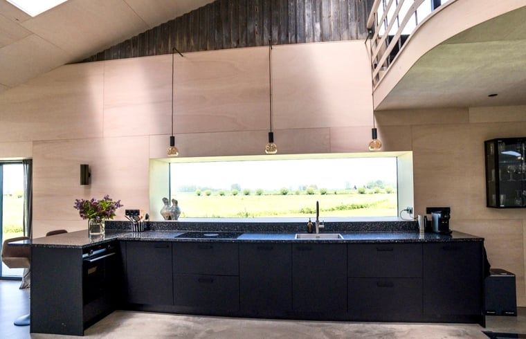 Spacious kitchen in Holiday home in Zalk overlooking the nature of Northwest Overijssel, Overijssel.