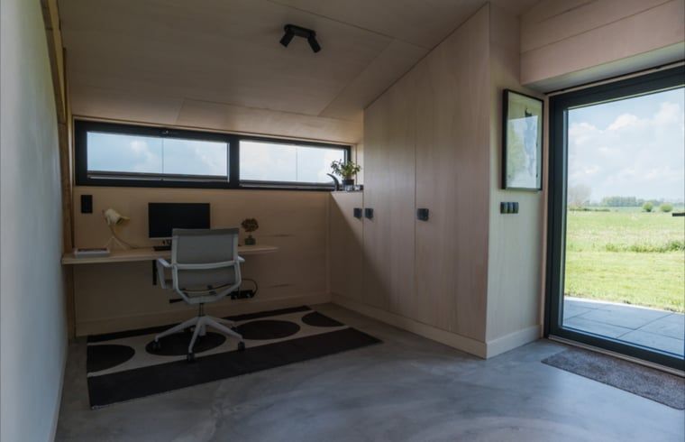 Cozy workspace with a view in Holiday home in Zalk, ideal for inspiration in Northwest Overijssel.
