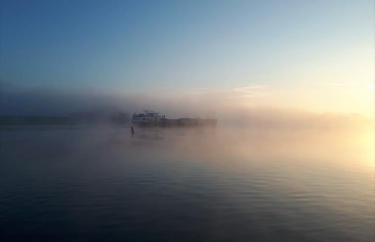 Misty morning on the water near Holiday Home in Zalk, a serene experience in Northwest Overijssel.