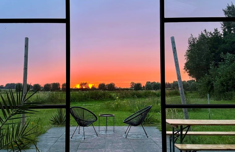 Breathtaking sunset from the terrace of Holiday home in Zalk, an unforgettable view in Northwest Overijssel.