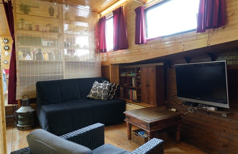 Cozy living room in Cottage in Vinkeveen, vacation home in Utrecht north, Utrecht with modern amenities.