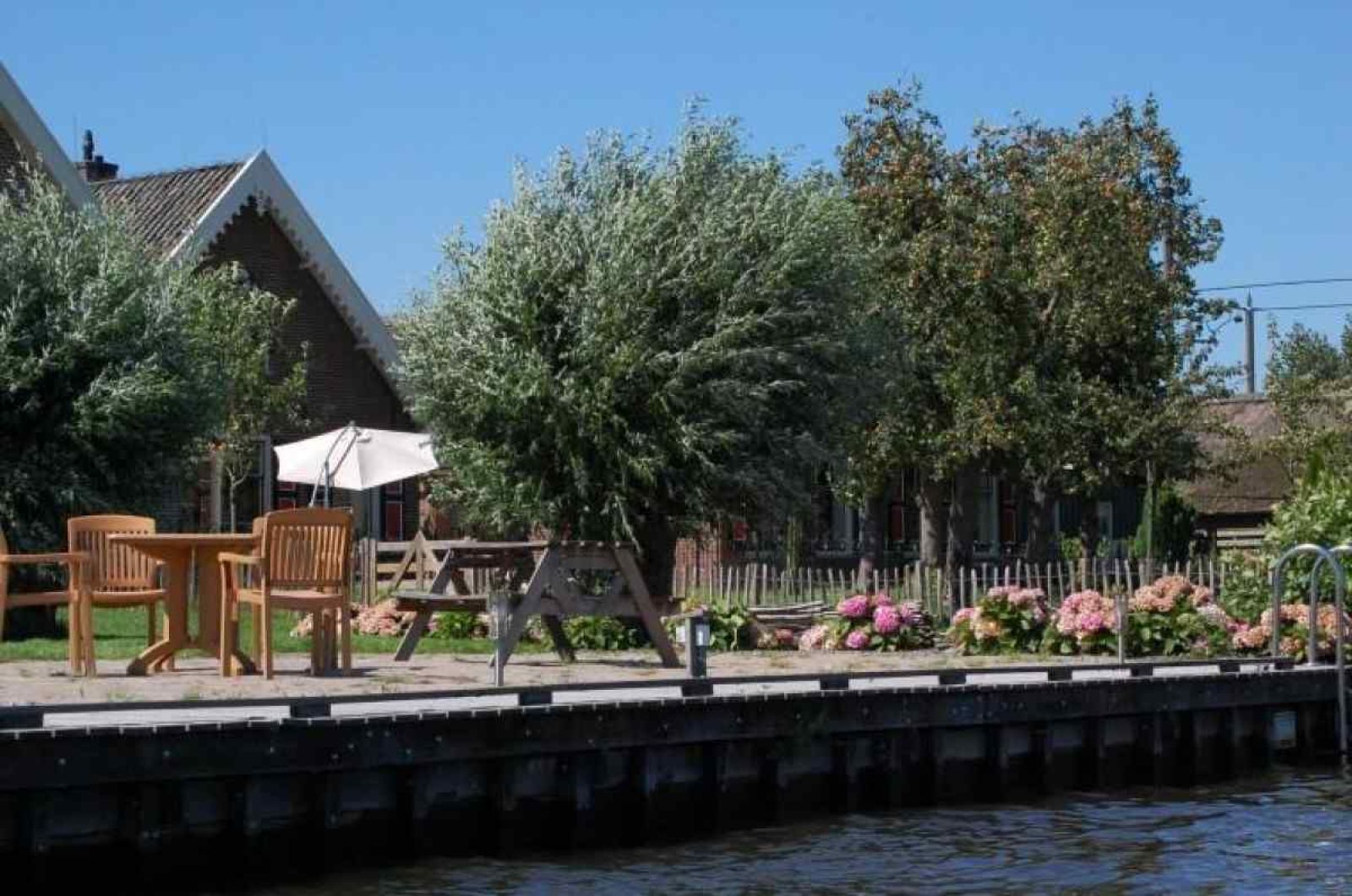 Ueberdachte Terrasse im Ferienhaus UT020 in Vreeland, Utrecht mit Sitzecke