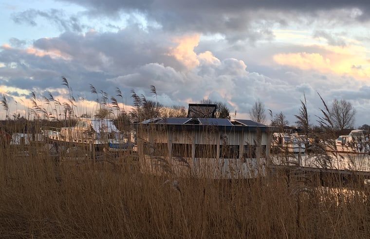 Enjoy a serene sunset at Huisje in IJsselstein, a vacation home in the nature of IJsselstein, Utrecht.