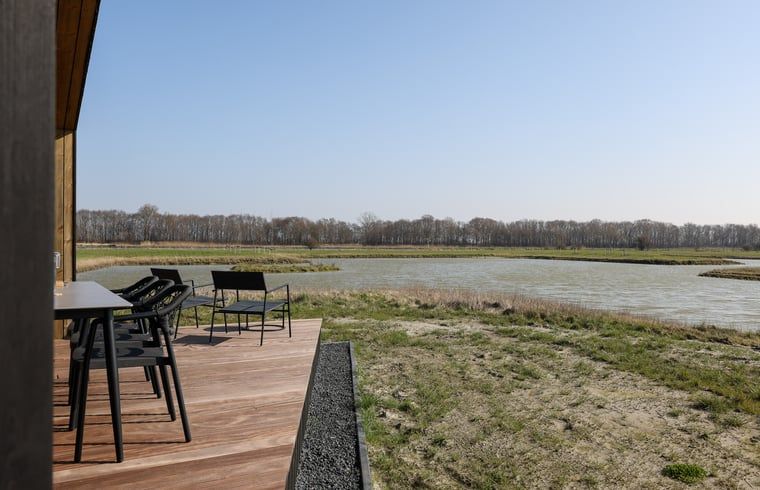 View over the water from the terrace of Cottage in Wissenkerke, located in Wissenkerke, North Beveland, Zeeland.