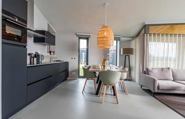 Open kitchen and dining area in Holiday home in Wissenkerke, Noord-Beveland, Zeeland.