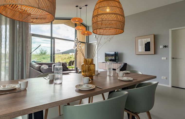 Bright dining room in Holiday home in Wissenkerke, Noord-Beveland, Zeeland with view.