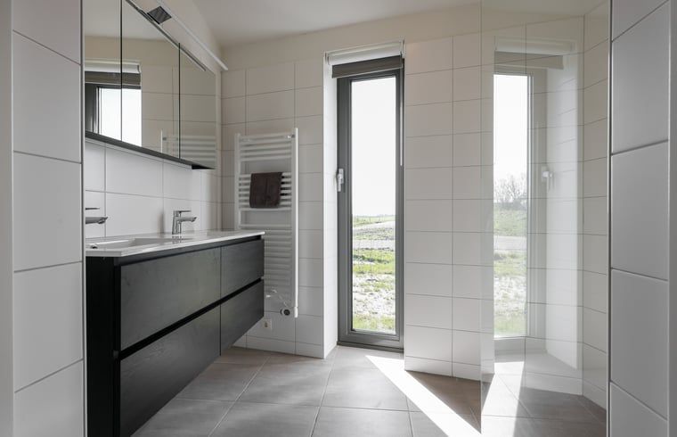 Modern bathroom in Holiday home in Wissenkerke, Noord-Beveland, Zeeland with lots of light.