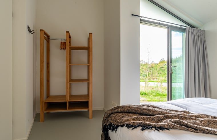 Terrace with dining table in Holiday home in Wissenkerke, Noord-Beveland, Zeeland.