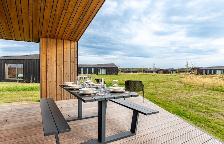 Outdoor area with seating in Holiday home in Wissenkerke, Noord-Beveland, Zeeland.
