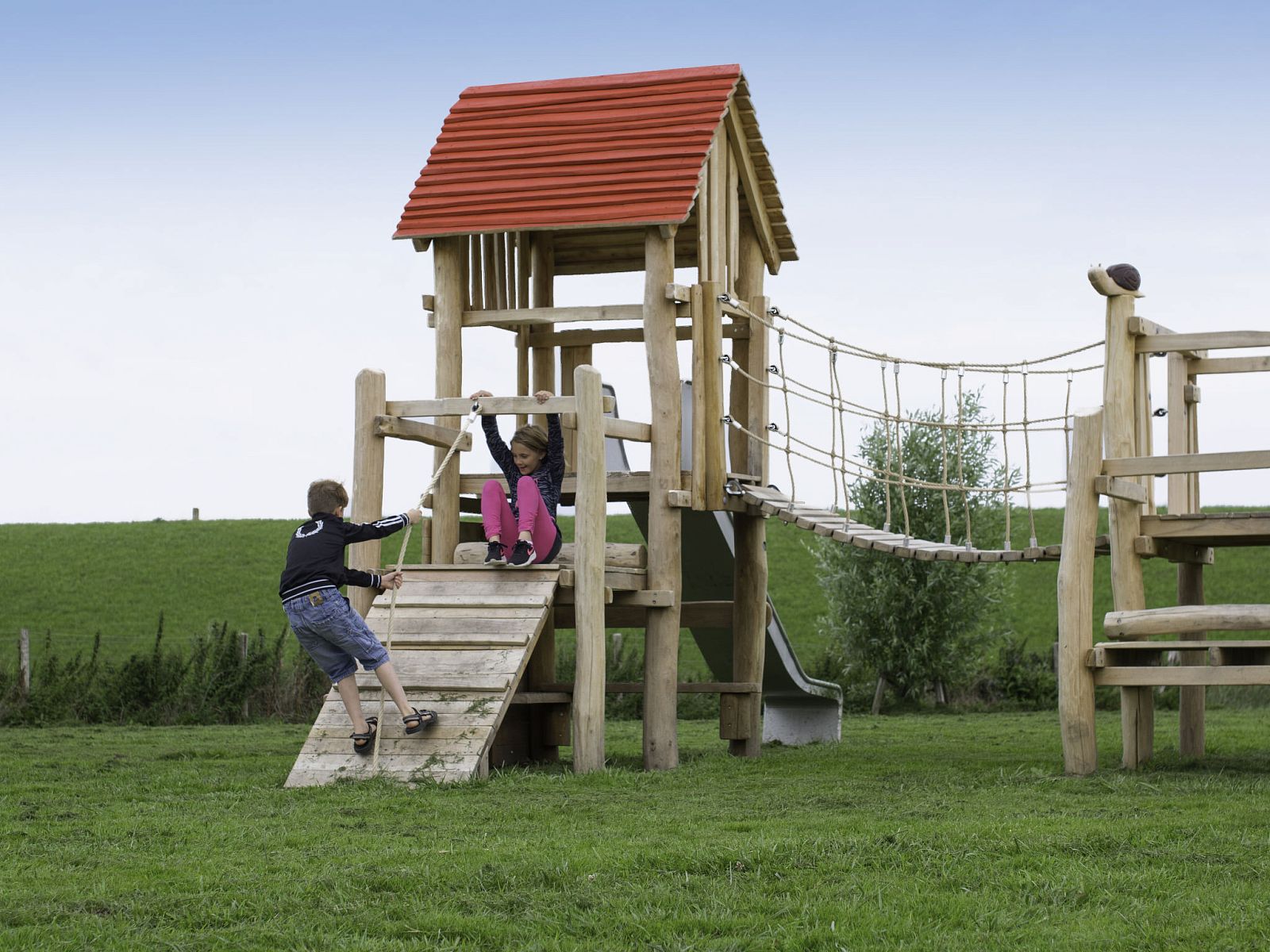 Playground at Holiday Home Ganuenta, Colijnsplaat, North Beveland with wooden climbing equipment for children.