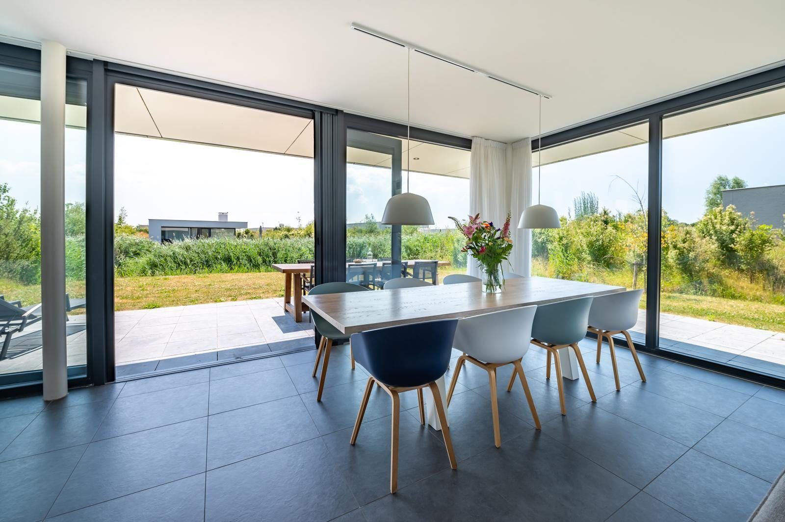 Stylish dining room of Duinvallei 10 | De Groote Duynen in Kamperland, a vacation home with modern facilities in North Beveland.