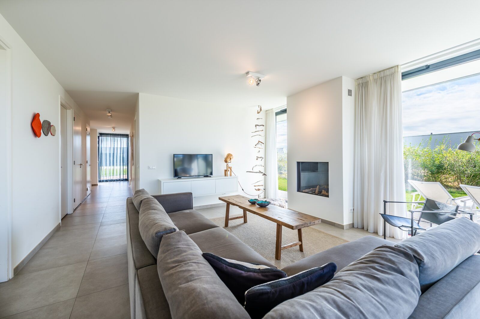 Modern living room with comfortable sofa in Waterline 09, bungalow in Kamperland, North Beveland.