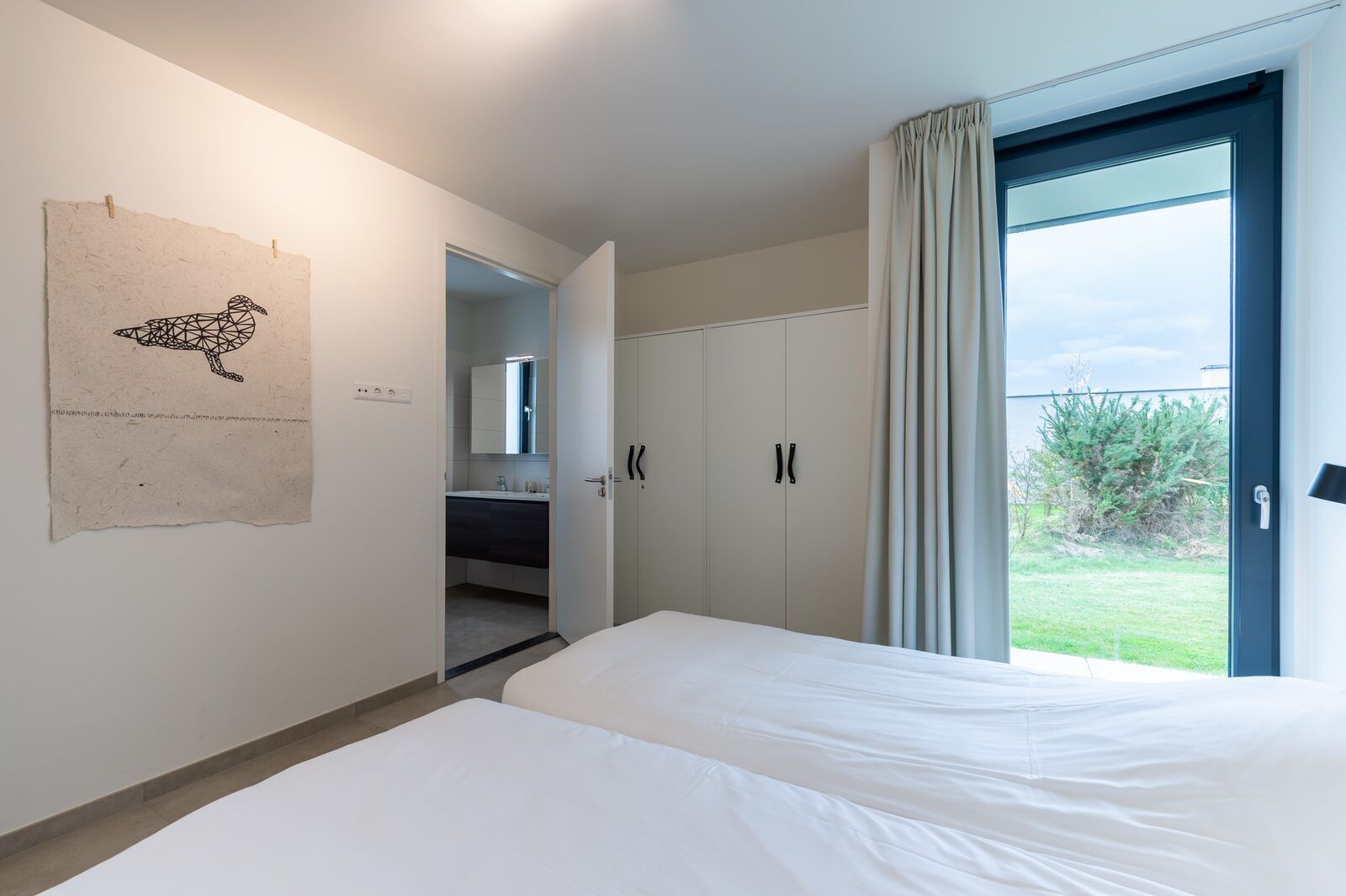 Bedroom with garden view in Waterline 09, bungalow in Kamperland, North Beveland.