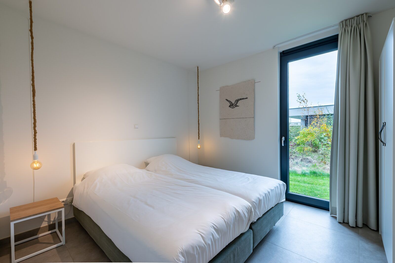 Comfortable bedroom with artwork in Waterline 09, vacation home in Kamperland, Zeeland.