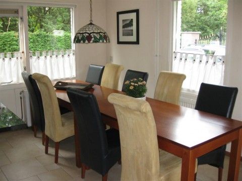 Spacious dining room in Mi Casa, Burgh-Haamstede, where guests can enjoy a meal in the vacation home.