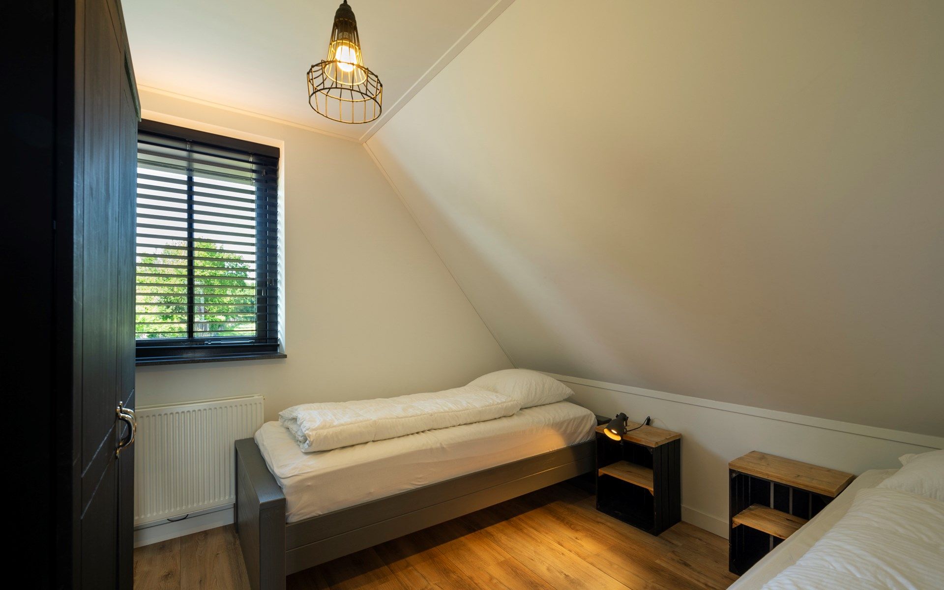 Kinderkamers met stapelbedden in Vakantievilla Paardenbos 5 in Burgh-Haamstede, een gezinsvriendelijke vakantiewoning in Zeeland.