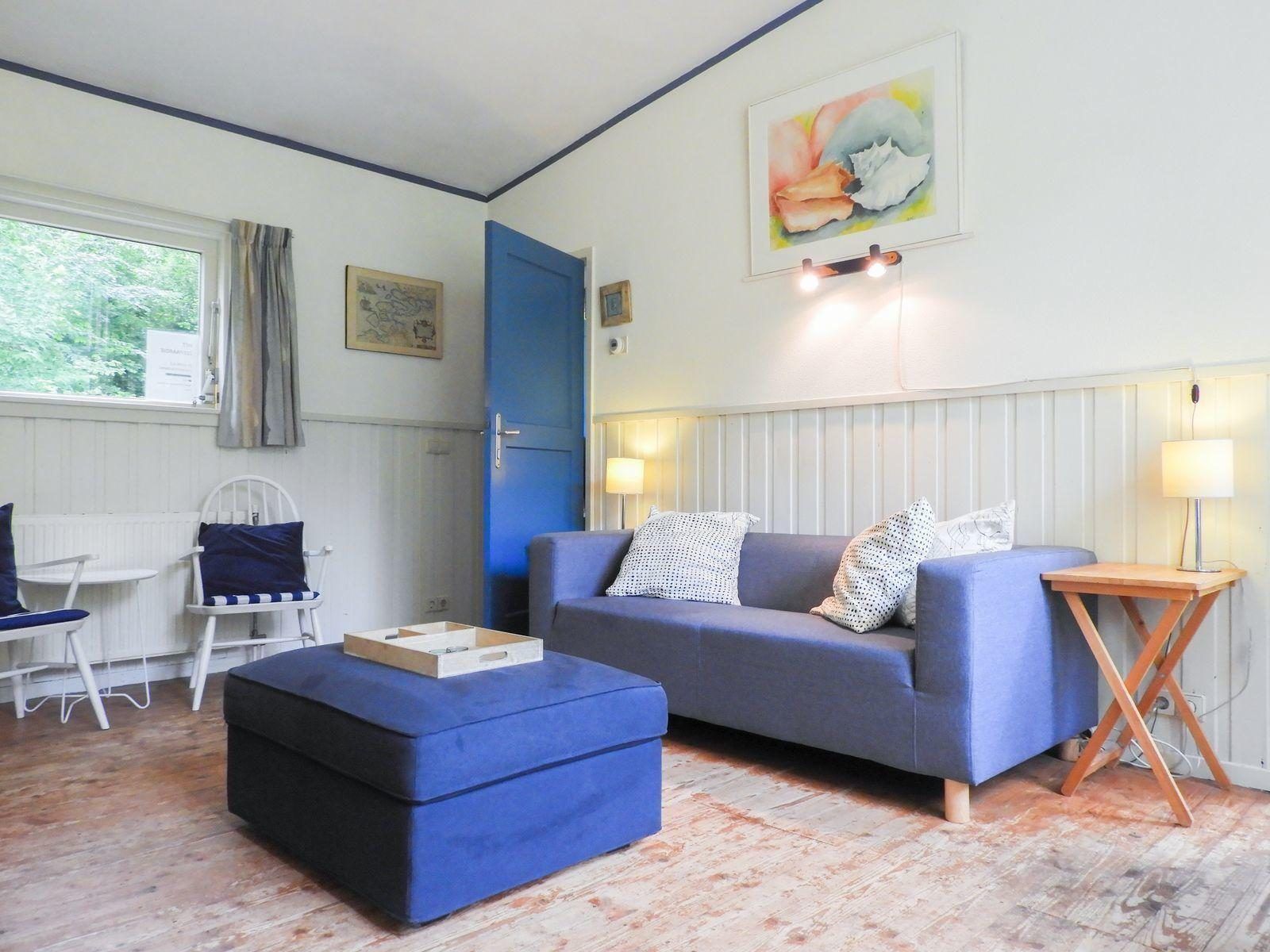 Gezellige woonkamer van VZ345 Vakantiehuis Burgh-Haamstede in Zeeland.