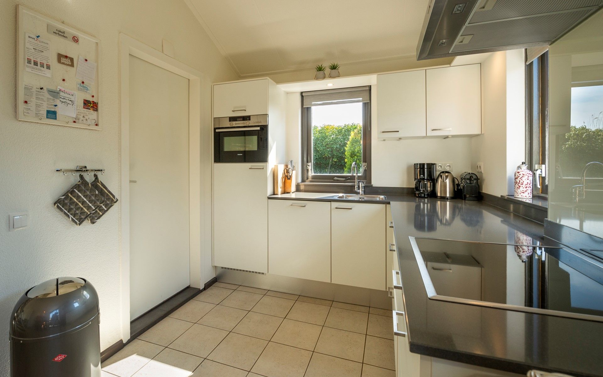Practical kitchen in Holiday home Schouwse Duin 35, Burgh-Haamstede with modern appliances in Zeeland.