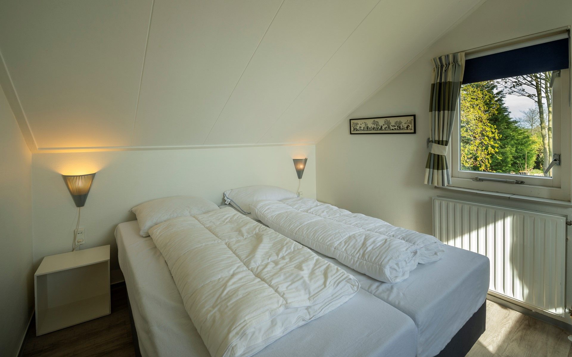 Cozy bedroom with single beds in Holiday home Schouwse Duin 35, Burgh-Haamstede, ideal for children in Zeeland.