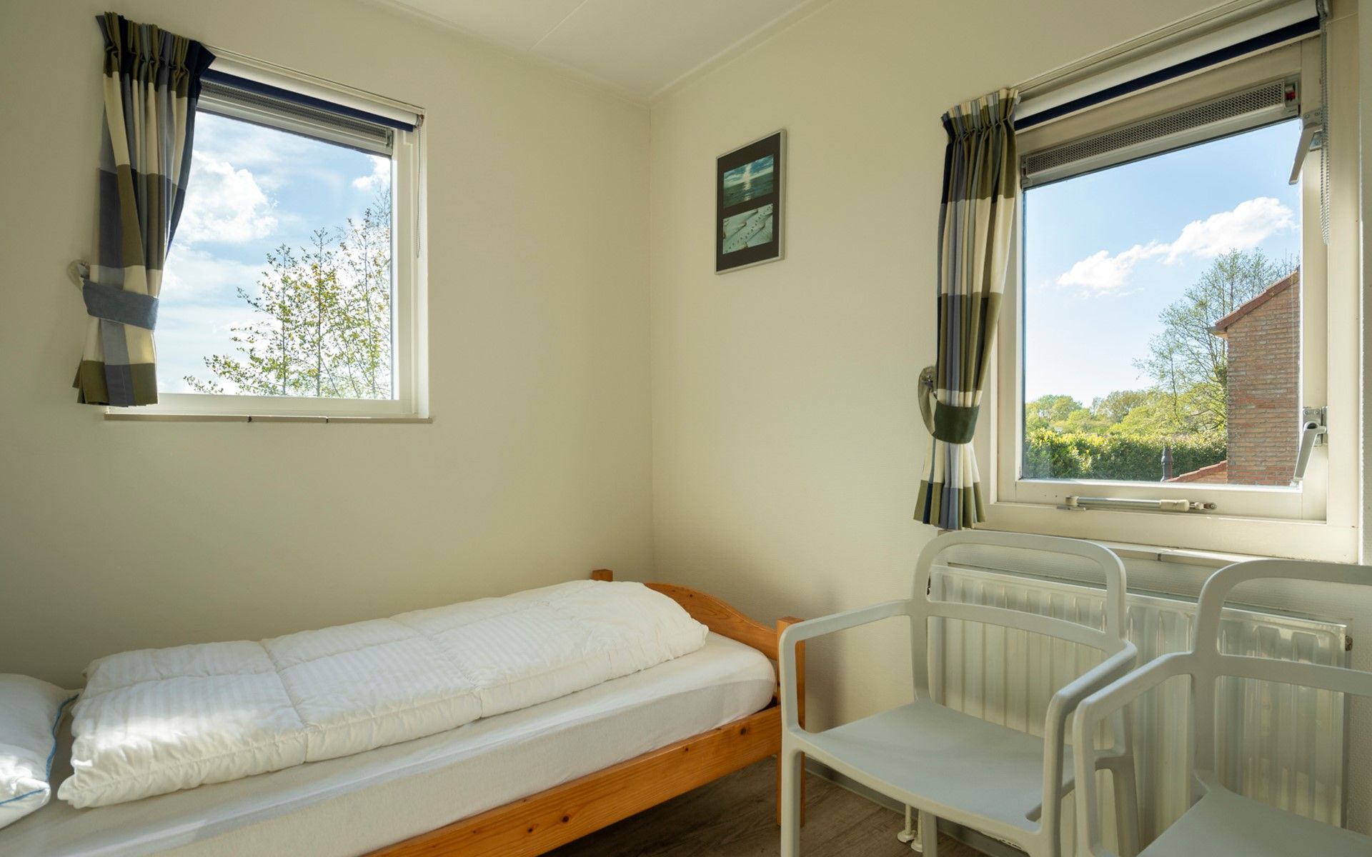 Cupboard full of board games in Holiday home Schouwse Duin 35, Burgh-Haamstede, perfect for cozy evenings in Zeeland.