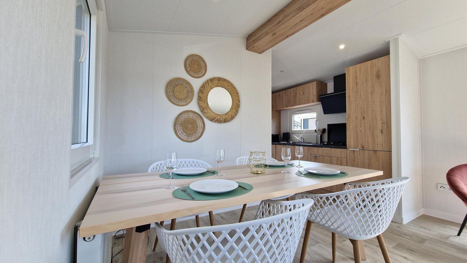 Stylish dining area with a view at VZ2326 Holiday Chalet Stern 1866 Renesse in Renesse, Zeeland.