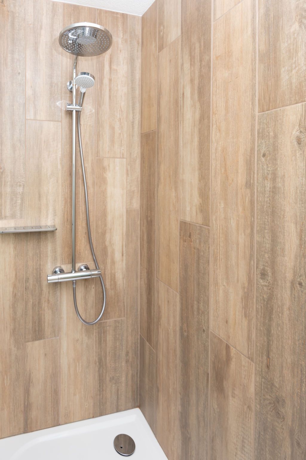 Modern shower in bathroom of Holiday Home Horizon by the Sea, Renesse, offers comfort and style.