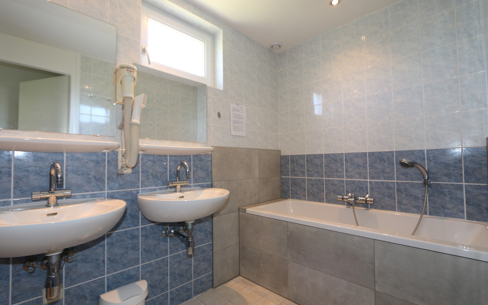 Bedroom with double bed in Horizon 95, Zeeland, offers a serene place for a good night's sleep.